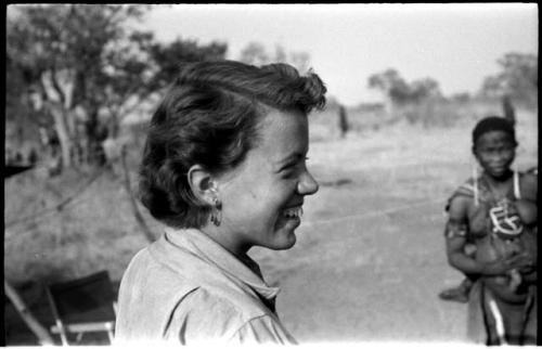 Elizabeth Marshall Thomas wearing a safety-pin earring, with a woman standing in the background