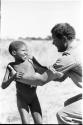 William Donnellan catching /Gaiamakwe after tossing him in the air