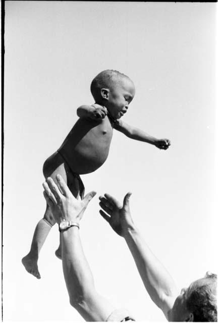 N!whakwe being tossed in the air by William Donnellan