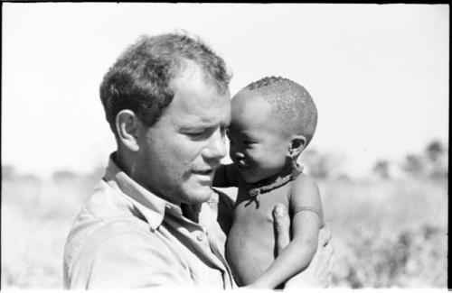 William Donnellan holding N!whakwe in his arms