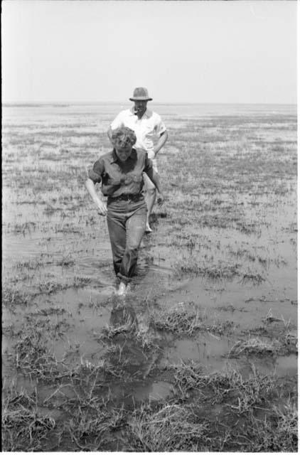 Casper Kruger and Elizabeth Marshall Thomas wading in Lake Ngami