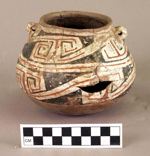 Small constricted neck jar of brown ware with polychrome decoration