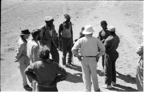 Group of people including Laurence Marshall, Lorna Marshall, Kernel Ledimo, Daniel Blitz, William Donnellan, and Herero people, seen from top of truck