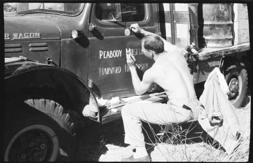 Bill Donnellan painting an expedition truck