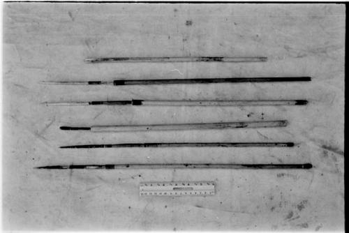 Six arrows showing various types; wood, bone, and poison tips