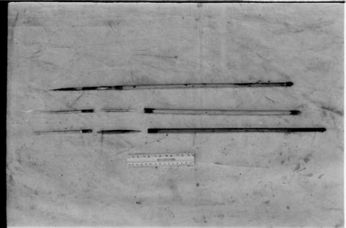 Three arrows against a white background with a ruler for measurement; shows bone point, connecting link, and shaft separated
