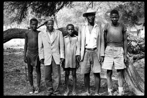 Portrait of a group of five men standing in a line