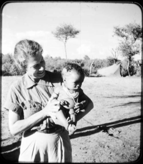 Baby being held by Lorna Marshall (copy of color slide 6E-82)