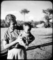 Baby being held by Lorna Marshall (copy of color slide 6E-82)