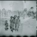 Group of children standing inside their kraal