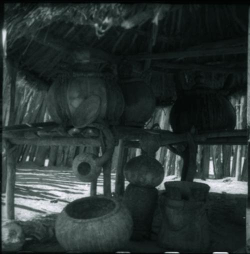 Gourds, pots and baskets inside storage hut