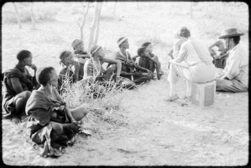 Lorna Marshall and Wilhelm Camm interviewing a group of people