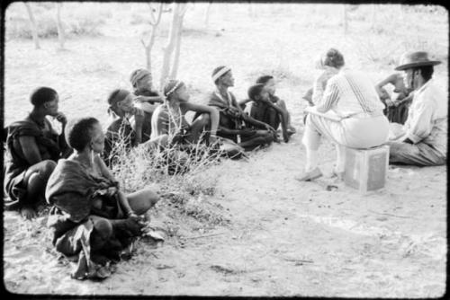 Lorna Marshall and Wilhelm Camm interviewing a group of people