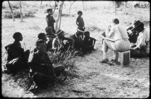 Lorna Marshall and Wilhelm Camm interviewing a group of people