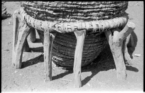 Storage basket braced by supporting rack, close-up