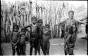 Hinga woman and children, standing