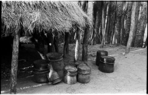 Wooden milk buckets and a funnel in a Hinga kraal