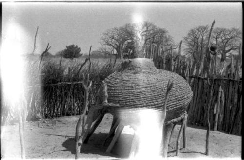 Storage basket on a raised platform (light struck)