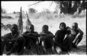 Five boys sitting near the expedition camp