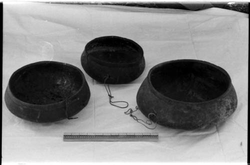 Three wooden bowls and a ruler for measurement