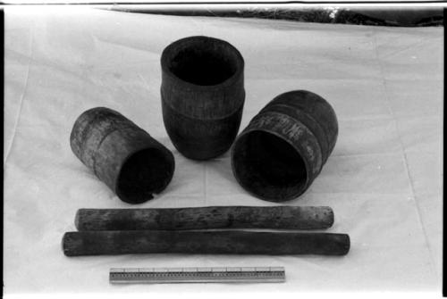 Three mortars and two pestles and a ruler for measurement