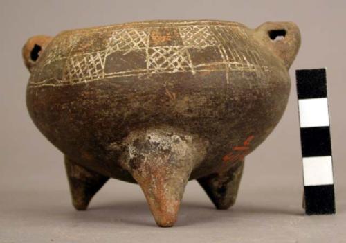 Tripod vessel, incised decoration