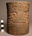 Pottery cup decrated with glyph-like designs