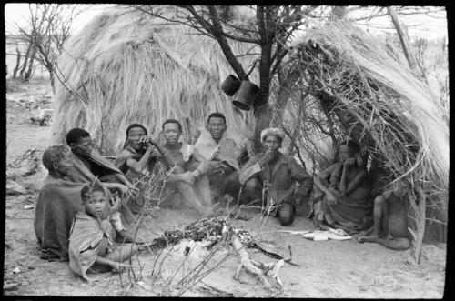 From left to right: a young boy; "old Xama"; /Naoku, wife of //Xoxa; ǂNobe; Kã?//a, husband of ǂNobe; //Kao/õ; Da/ho; //?Axa, wife of Da/ho; and a boy sitting in front of Da/ho's skerm