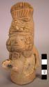 Ceramic figurine, moulded, incised and applique human figure with headdress
