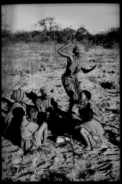 Group of women playing the dandiri; Dadum dancing