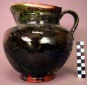 Ceramic green glazed lidded pitcher