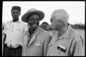 Mopare and Laurence Marshall, sitting next to two other people, close-up view