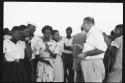 Group of people standing with C.J. Mathias