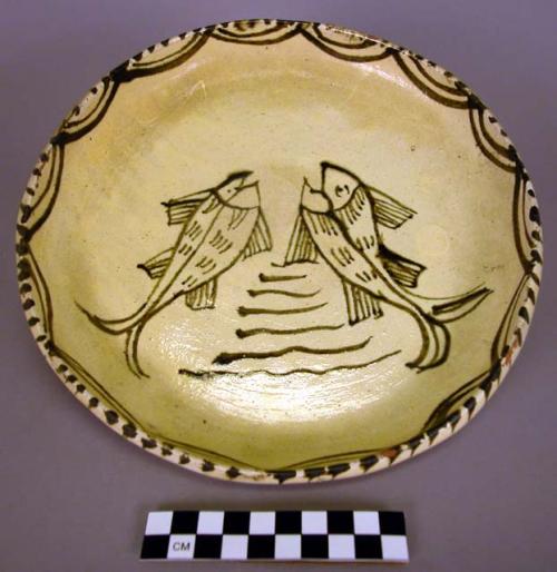 Ceramic brown on buff glazed dish with fish motif