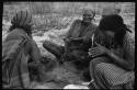 Group of women sitting and playing the dandiri