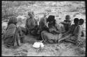 Group of women sitting and playing the dandiri