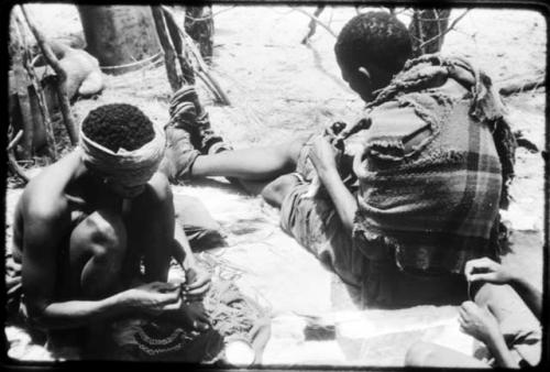 Dadum and Tama sitting and working on beadwork and sewing (copy of color slide 2001.29.8365)