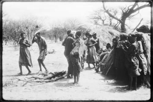 Group of people performing the Eland Dance, with !Ani followed by Tchobe (copy of color slide 2001.29.8675)