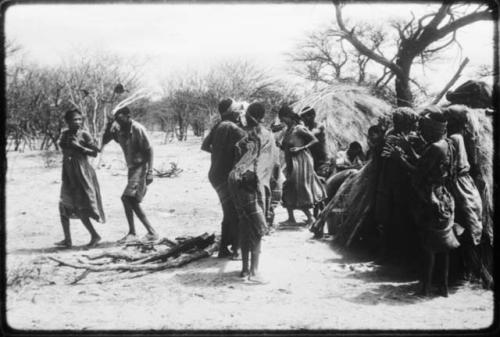 Group of people performing the Eland Dance, with !Ani followed by Tchobe (copy of color slide 2001.29.8675)