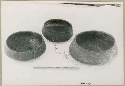 Three wooden bowls, with a ruler for measurement