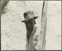 Man wearing a hat, at a meeting between expedition and Isaac Otuhile (print is a cropped image)