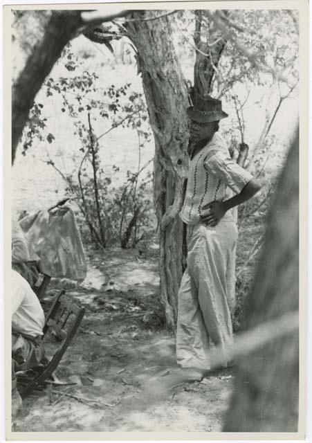 Man wearing a hat, at a meeting between expedition and Isaac Otuhile (print is a cropped image)