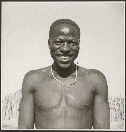 Man showing his filed teeth