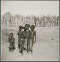 Group of children standing inside their kraal