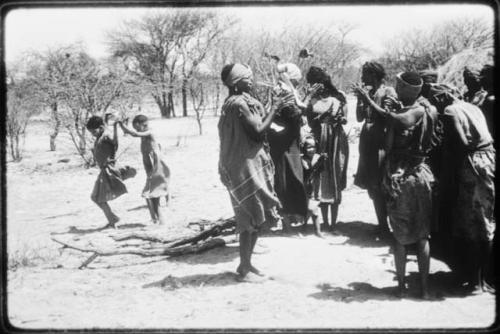 Group of women dancing, with little girls dancing behind them (copy of color slide 2001.29.8662)
