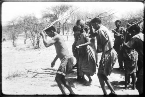 Gaishay and Tchobe, the husband of ≠Kxoba, wearing horns and dancing, performing the Eland Dance (copy of color slide 2001.29.8664)