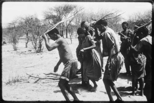 Gaishay and Tchobe, the husband of ≠Kxoba, wearing horns and dancing, performing the Eland Dance (copy of color slide 2001.29.8664)