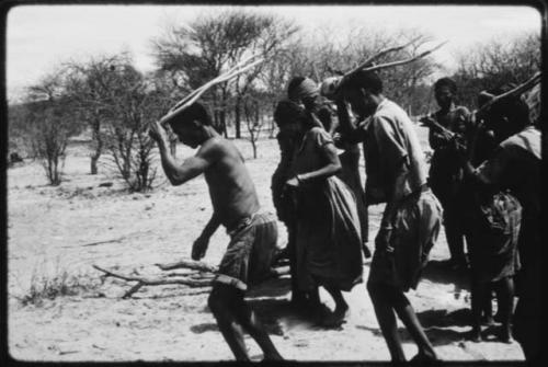 Gaishay and Tchobe, the husband of ≠Kxoba, wearing horns and dancing, performing the Eland Dance (copy of color slide 2001.29.8664)