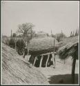 Large storage basket for grain in cradle, with plastered top instead of thatched roof