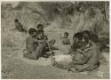 /Naoka, first wife of /Ti!kay, performs a choa ceremony for her daughter, Bau, wife of Tsamgao, distant view (print is a cropped image)